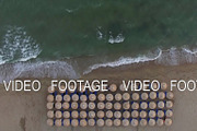 Empty sunbeds at the seaside, aerial