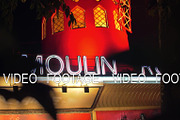 Moulin Rouge at night, view through