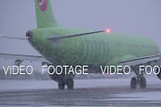 Airplane moving in blizzard