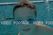 Child diving in outdoor swimming