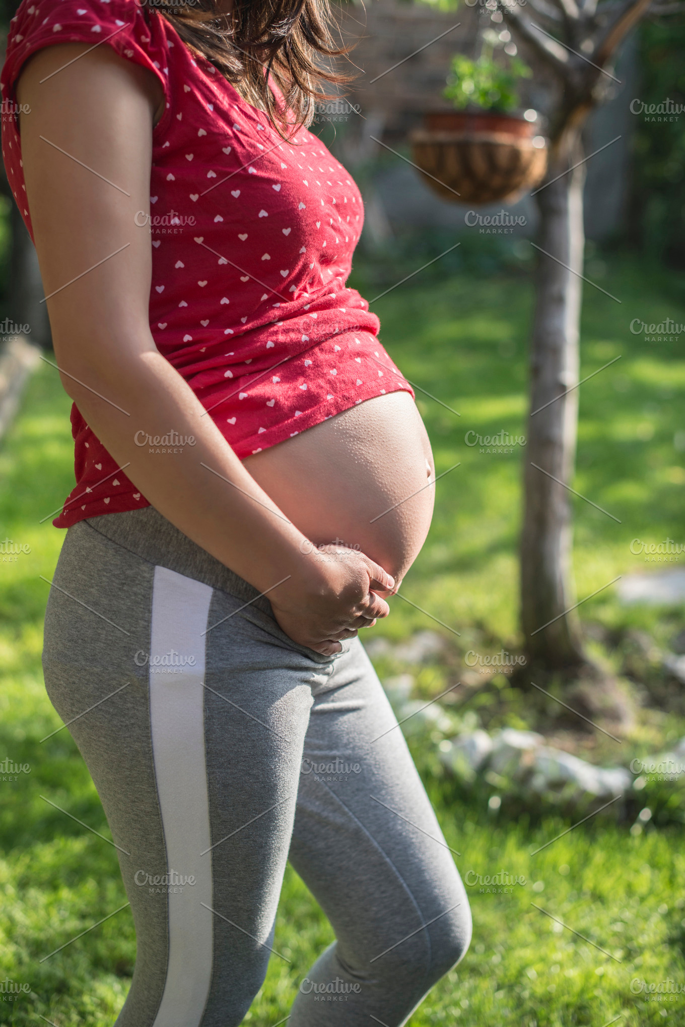 Pregnant Woman Shows His Belly In T High Quality People Images 