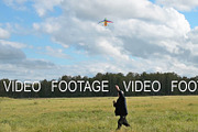 Active senior man flying kite