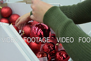 Woman choosing Christmas balls in