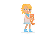 Girl Holds Small Cat in Hands