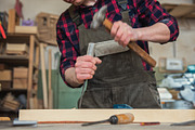 Carpenter working with a chisel