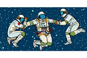 three astronauts in space in zero