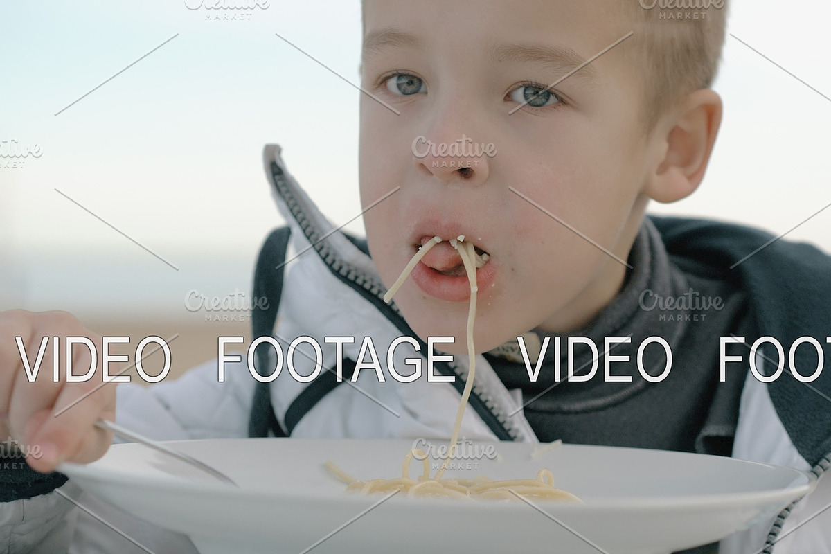 Young boy eating pasta outside in Graphics - product preview 8