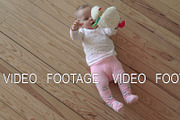 Baby girl playing on the floor