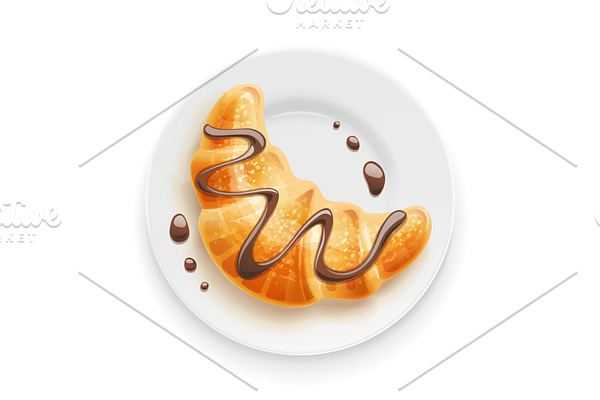 Croissant with chocolate on plate.