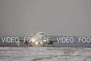 Jet plane departure on a snowy