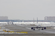 Planes taxiing on the snowy runway