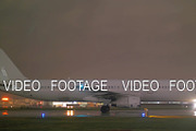 Passenger jet plane on a wet runway