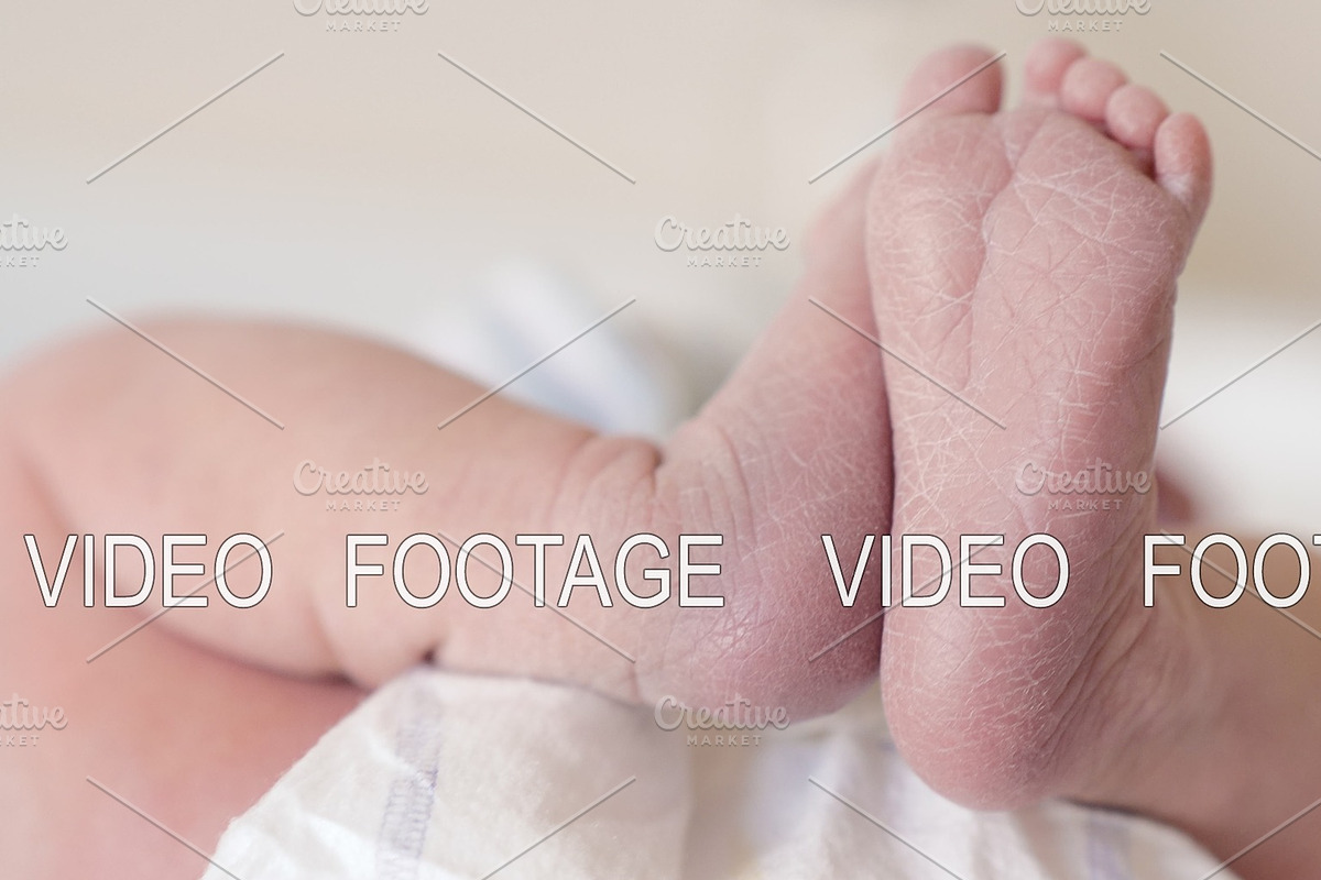 Newborn baby girl with her feet in in Graphics - product preview 8