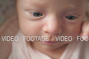 Newborn baby girl making faces