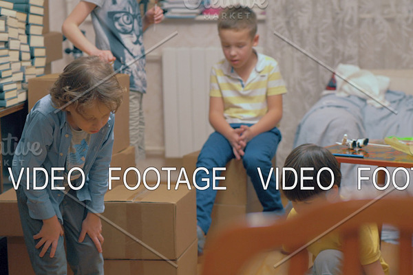 Group of kids playing among boxes at
