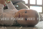 Active baby girl playing with toy on