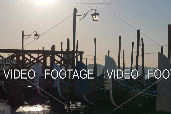 Scene of Venice dock with gondolas