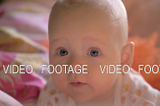 A closeup of a cute baby girl on
