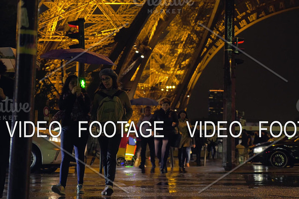 People crossing the street by Eiffel