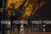 People crossing the street by Eiffel