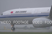 Air China airplane taxiing on wet