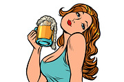 Woman with a mug of beer in profile
