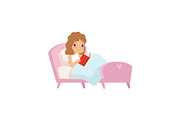 Cute Girl Reading Book in Bed