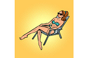 woman in swimsuit sunbathing