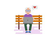 Old man texting on laptop