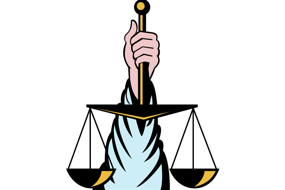 Hand holding scales of justice