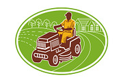 male gardener riding lawn mower