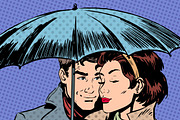 Rain man and woman under umbrella