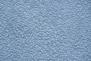 Smooth blue painted stone stucco