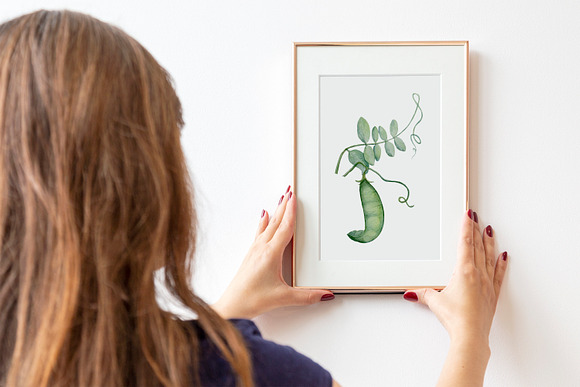 Woman holding frame on wall Mockup in Product Mockups - product preview 1