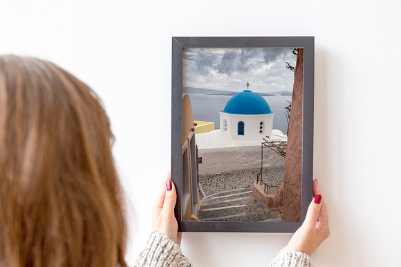 Woman holding a black frame mockup in Product Mockups - product preview 1