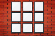 Red brick wall with picture frames
