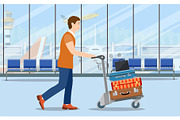 man with luggage trolley in airport.