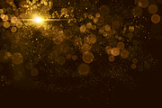 Abstract gold bokeh with particles