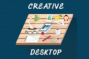 creative desktop with book