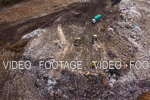 Aerial view on bulldozers working on