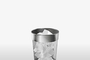 Steel trash can with paper garbage