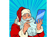 Santa Claus and a big smartphone