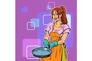 Woman housewife with a frying pan