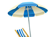 Deck chair with umbrella on beach