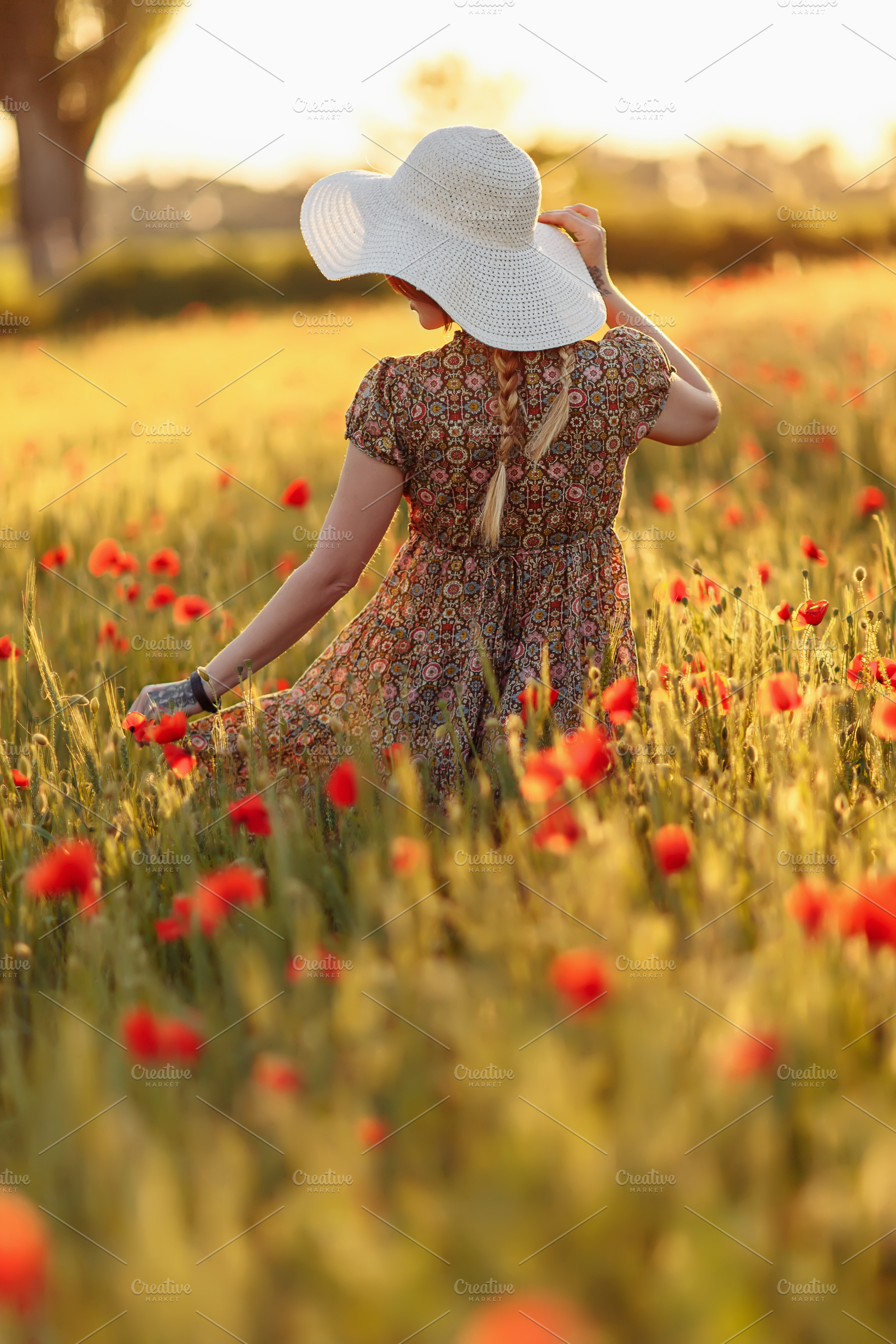 Redhead woman in hat on green field | High-Quality People Images ...