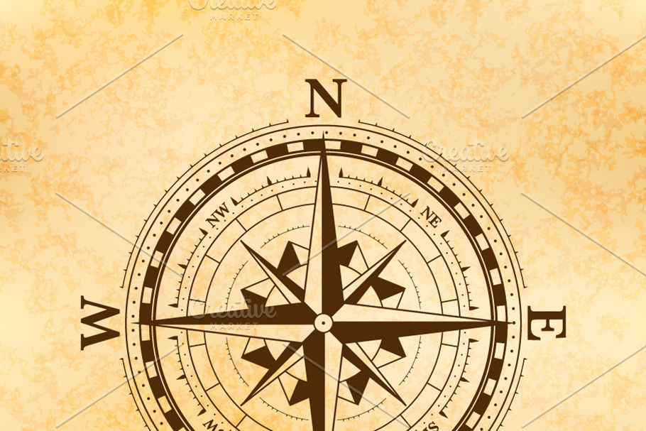 Ancient compass icon on old paper