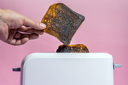 burnt bread in the toaster close-up