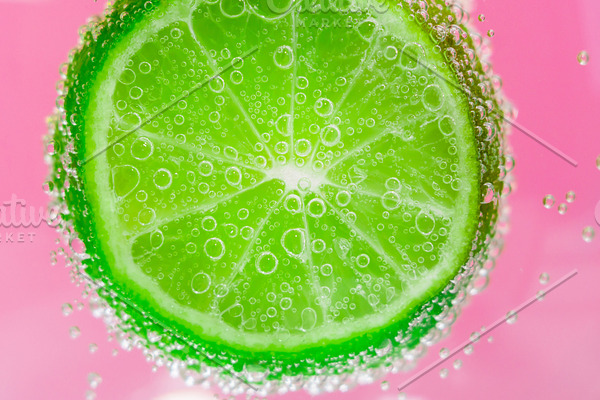 lime in a spray of water. lime