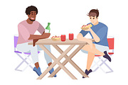 Two men eat and chat at table