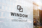 Black logo mockup on store window